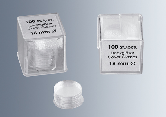Two transparent plastic boxes labeled "100 St./pcs. microscope cover glass no.1 thickness (0.13 - 0.16mm) 16 mm" contain stacks of round cover glasses.