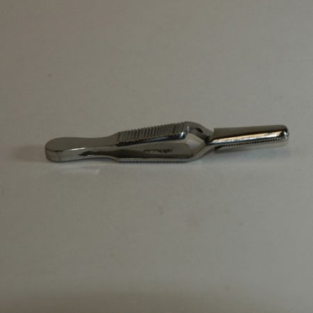 A compact Bulldog Vascular Forcep on a white surface.