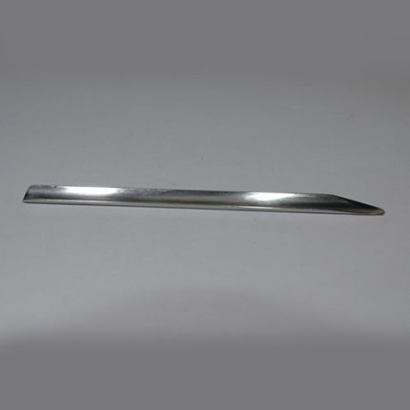 A Spatula for Specimens on a white surface.