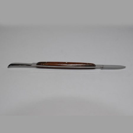 A Wax Knife with a Wooden Handle showcased on a white surface.