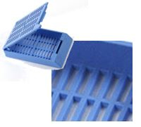 The uni-safe embedding cassette with lid is shown in blue, partially open, next to a close-up view highlighting its slotted interior.