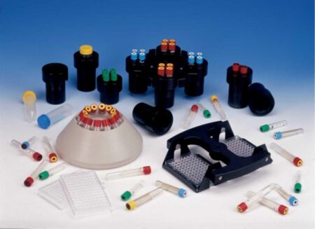 Refrigerated Centrifuge Medium Capacity, Refrigerated, 4x100ml without Rotor tubes, adapters, and micropipette tips are neatly arranged on a surface.