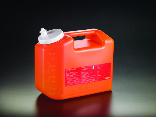 A 24hr urine collection bottle, crafted from red plastic and equipped with a white lid and handle, featuring measurement markings and a label with text on the side, is set against a dark background.