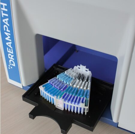 Medical test strips are neatly organized in a multi-tiered Hydra Universal Tray, partially extended from a machine labeled "DreamPath," showcasing its universal functionality.
