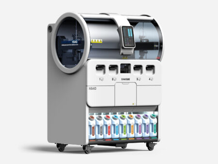 The IHC Stainer, Fully Automated, features a modern touchscreen display, four dispensing slots, and multiple labeled reagent containers conveniently stored along the bottom.