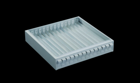A metal slide and storage cabinet featuring a rectangular white plastic tray with multiple parallel slots and a row of tabs on one edge, designed for organized storage, shown against a black background.