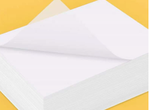 A pack of Blotting Paper, White, high absorbency, 45 X 57cm (200/Pack), with one sheet partially lifted against a yellow background.