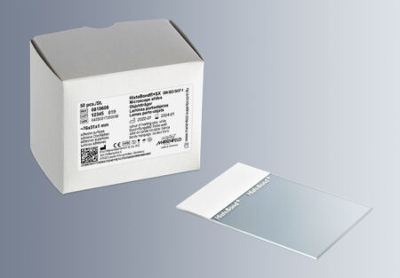 A box labeled "HistoBond® SX Adhesive Microscope Slide 76x51mm, White, 90° Ground Edge (50x45/Carton)" and a single slide are on a grey surface.