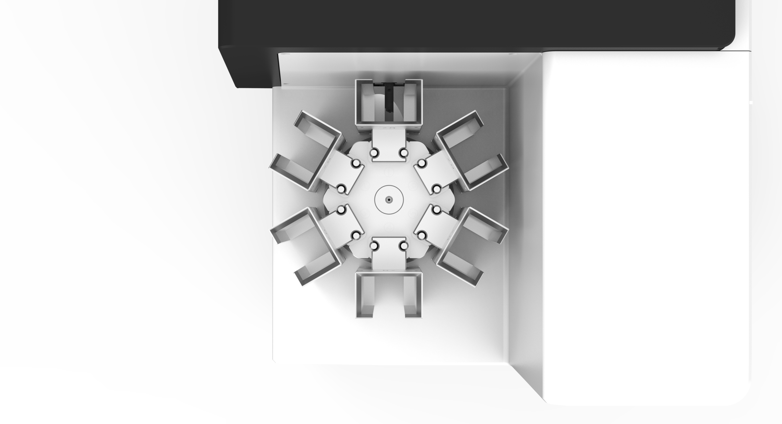 Overhead view of a round table with eight chairs near two corner walls—ideal for collaborative meetings or displaying the SurePrint C100 Laser Cassette Printer with Carousel for 6 Colours^.