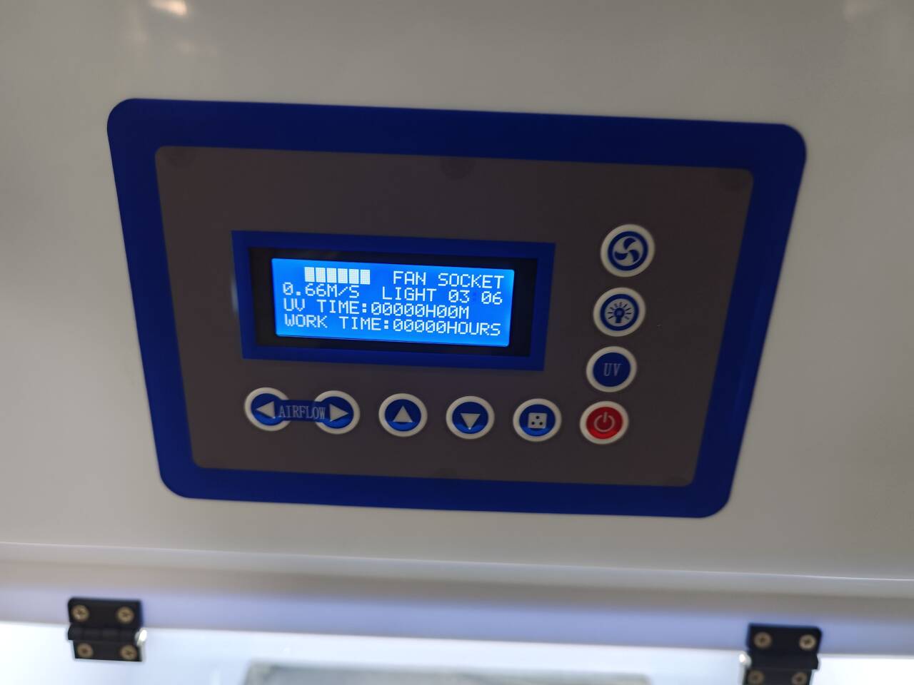 A close-up of the Ductless Polypropylene Fume Hood (700x700x1100mm) digital control panel shows airflow speed, light status, UV time, and work time on display with buttons and indicator lights clearly visible.
