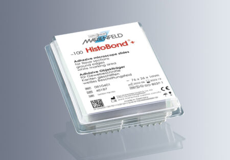 A plastic case contains HistoBond® + Microscope Slides, White, with a 90° ground edge (20x100/carton), featuring a white marking area and labeled with product and company details.