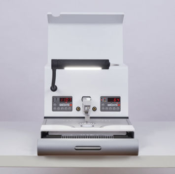 A TES 99 White Cooling unit for rapid cooling of up to 110 blocks (-15°C to 15°C, 500x545x330mm) features dual digital displays, a central nozzle, and a partially open lower compartment on a white surface.