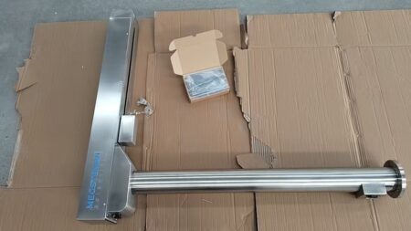 A Lifting Crane System for Biobank Series Tanks is placed on cardboard next to an open box containing accessories and installation materials.