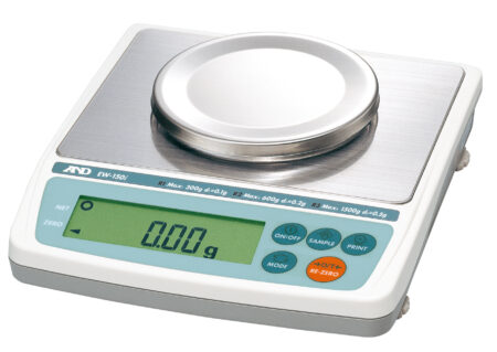 Digital laboratory weighing scale with a circular stainless steel platform and an electronic display showing 0.00 grams. Several buttons are visible for operation.