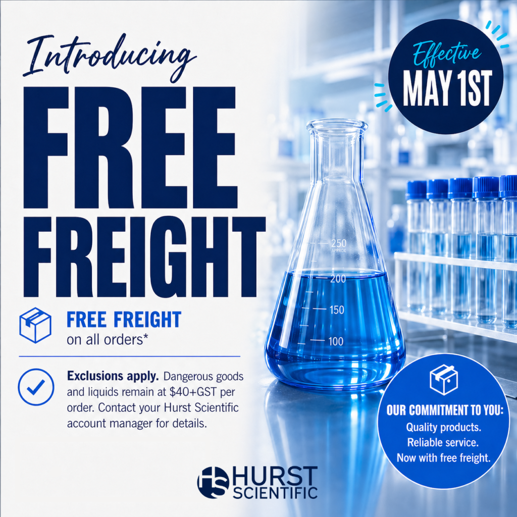 Announcement for Hurst Scientific: Free freight on all orders starting May 1st, with exclusions for dangerous goods and Holiday Closure periods. Features a laboratory scene with glassware and blue liquid.