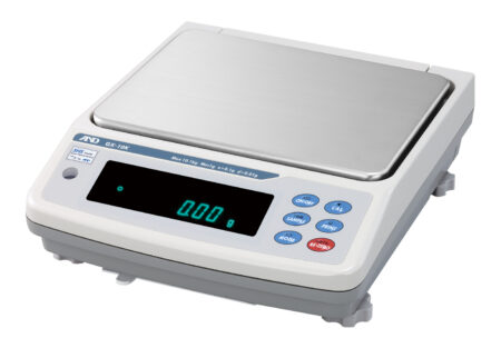 Digital laboratory scale with a stainless steel weighing platform, an electronic display showing "0.00 g," and several control buttons on the front panel.