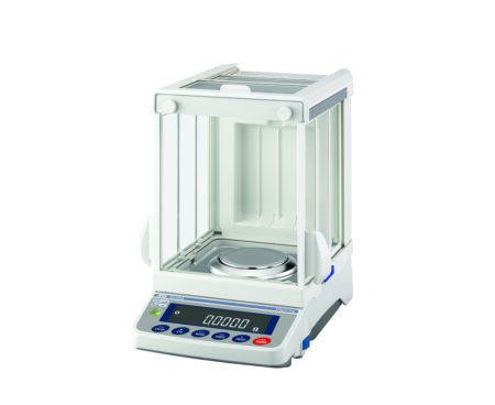 A digital analytical balance with a glass draft shield, displaying zero on its digital screen and control buttons on the front panel.