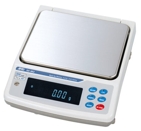 Electronic digital laboratory scale with a stainless steel weighing platform, digital display showing "0.00 g," and several function buttons on the front panel.