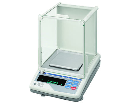 Electronic analytical balance with a glass enclosure, digital display showing 0.0001, and multiple control buttons on the front panel.