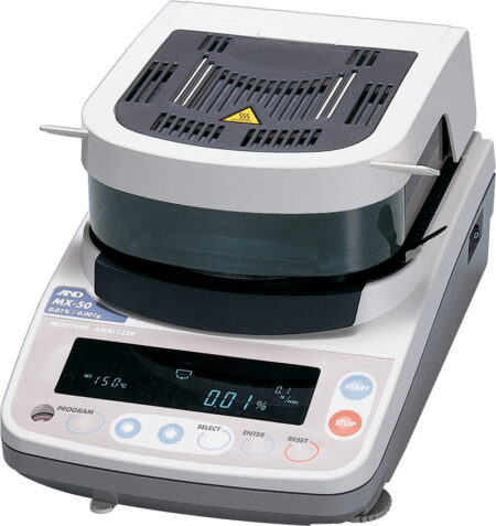 A laboratory moisture analyzer with a digital display showing measurements, control buttons, and a heating element on top.