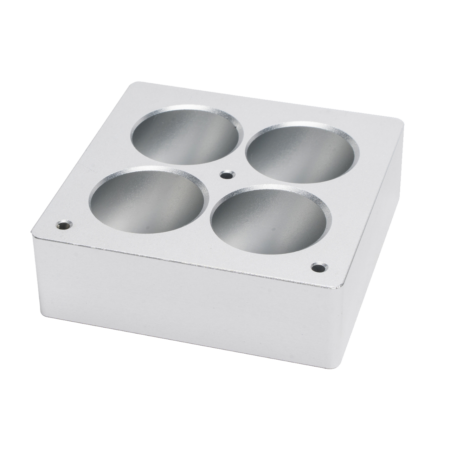 A square silver metal block with four circular holes and two small screw holes on the top surface.