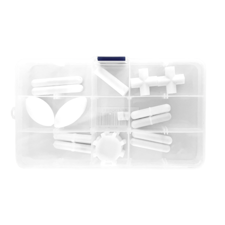 A plastic organizer box with nine compartments, each containing various white plastic geometric objects and shapes.