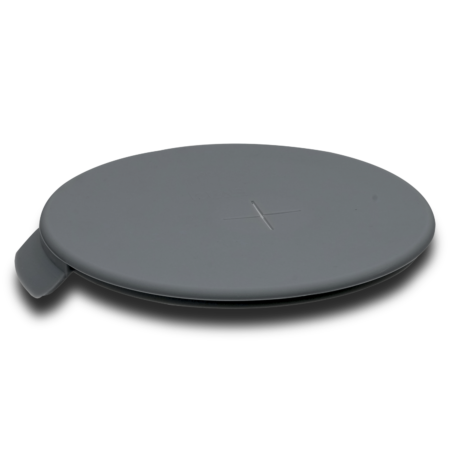 A round, flat, gray wireless charging pad with a subtle cross symbol in the center and a small side tab, placed on a white background.