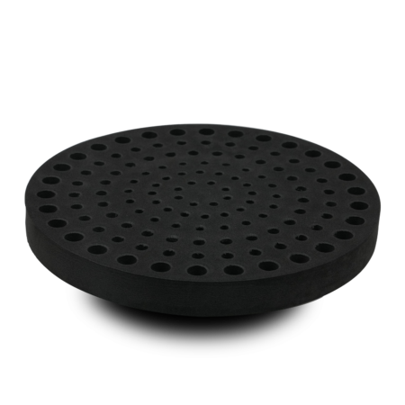 A round, black disc with multiple evenly spaced holes arranged in concentric circles, shown against a white background.