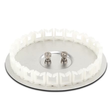 Circular metal disc with two protruding screws in the center and a ring of evenly spaced white plastic clips around the edge.