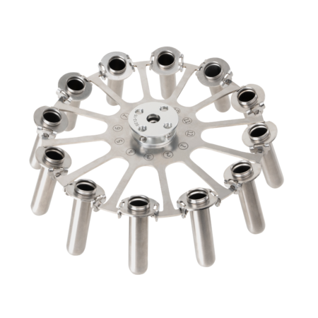 Metal rotor with twelve evenly spaced cylindrical holders attached to a central hub, likely for laboratory tube or vial placement.