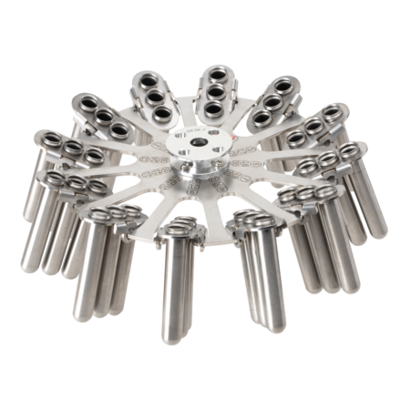 A metal device with multiple cylindrical tubes arranged radially around a central hub, resembling an industrial or laboratory component.