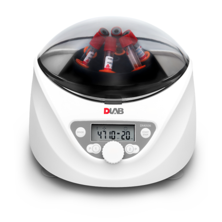 A compact white laboratory centrifuge with a digital display, holding several test tubes with red caps under a transparent lid.