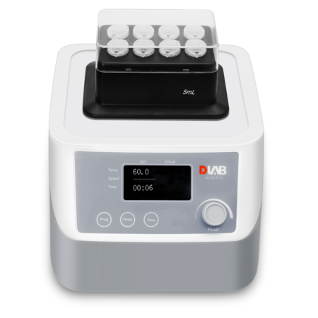 A laboratory device with a digital display showing settings for temperature, speed, and time, with a tray holding 5mL vials on top.