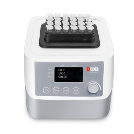 A laboratory vortex mixer with a digital display, holding multiple sample tubes arranged in a black tray on top.