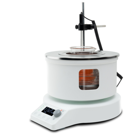 A white laboratory water bath with a digital control panel, a transparent lid, and a temperature probe, holding a glass beaker with orange liquid inside.