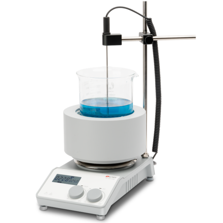 A laboratory hot plate stirrer with a digital display heats and stirs a beaker containing blue liquid; a temperature probe is attached above the beaker.