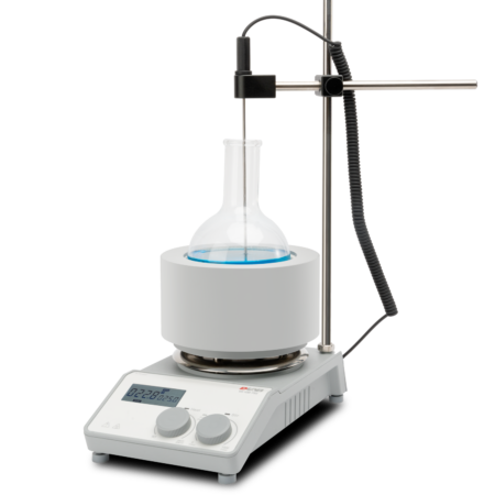 A laboratory heating mantle setup with a round-bottom flask, a temperature probe, and a digital control unit.
