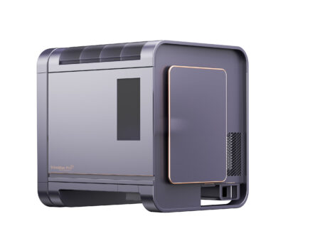 The TrimStar Pro™ Series 1 is a sleek, modern desktop tower featuring a matte gray finish, gold accents, and a side ventilation panel.