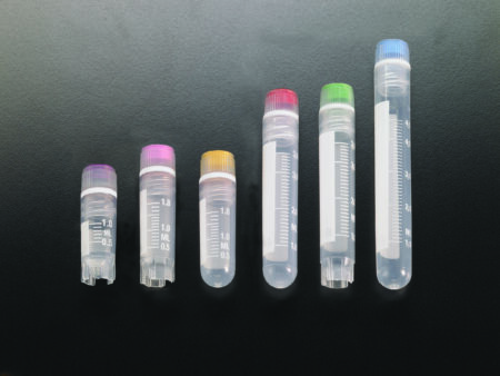 Six transparent plastic centrifuge tubes of varying sizes, including the Cryovial 2ml with an internal thread, cap, and washer seal (self-standing), are arranged in a row on a black surface. The self-standing design and colored caps enhance both functionality and visual appeal.